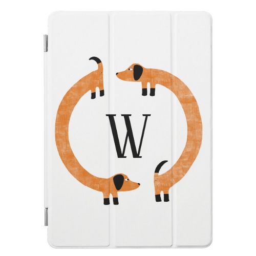 Cute iPad case with monogram surrounded by two cute dachshund sausage dogs.