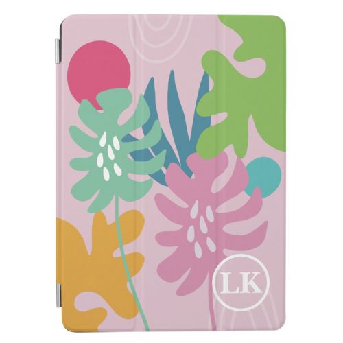 Cute iPad case in a modern style design with, green, teal, mustard and pink on a light pink background with monogram initials in white in bottom right corner.